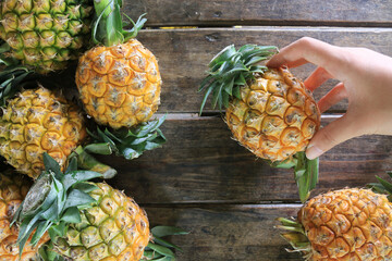 Pineapple on wooden grunge background