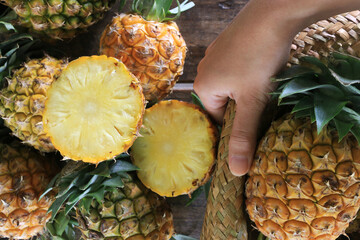Pineapple on wooden grunge background