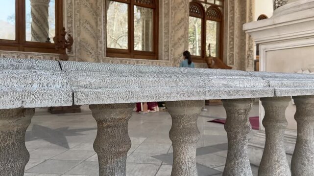 Tehran city attraction in Ferdows Garden palace Traditional old mansion architecture Stone railing and column scenic view of People walking outdoor urban park summer travel landmark Middle East Saudi