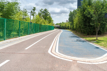 Fototapeta premium New pathway and beautiful trees track for running or walking and cycling relax in the park