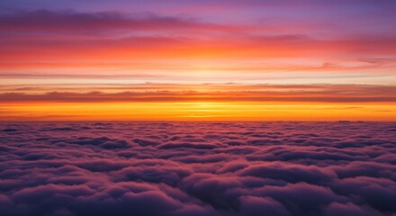 Sunrise above clouds with golden light illuminating soft fluffy cloud formations