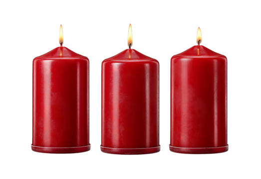 Three red pillar candles burning isolated on a transparent background