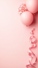 Pair of pink balloons floating with curling ribbon against a soft pink backdrop