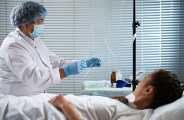 Naklejka premium Medical procedure with IV drip in clinic