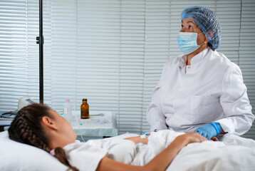 Nurse Preparing and Administering an IV Drip to a Young Patient