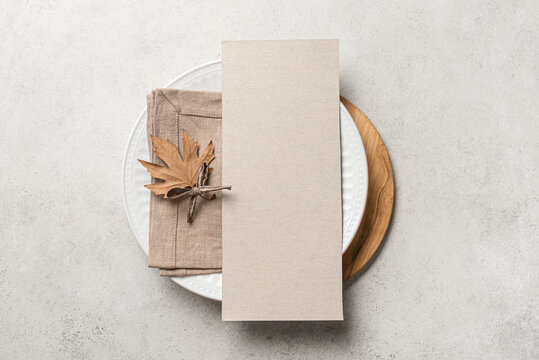 Blank 4x9 menu card  on table setting with autumn leaves