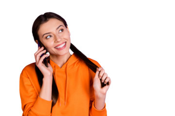 Portrait of charming positive cheerful teen girl call her friends with cellphone have conversation break pause wear orange sporty wear isolated over violet purple color background