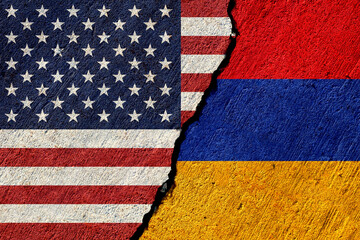 usa and armenia flags painted on cracked concrete wall