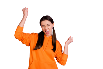 Portrait of delighted funny funky millennial teenager girl raise her fists scream yeah feel lucky celebrate victory wear sportswear isolated over violet purple color background