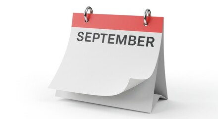 A desk calendar showing the month of September with the top page flipped over to reveal a blank page