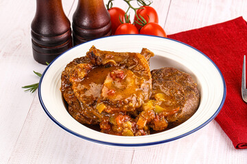 Italian cuisine - ossobuco with sauce
