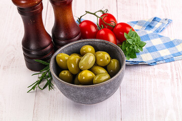 Green marinated olives in the bowl