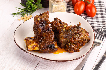 Prepared tasty beef ribs with sauce