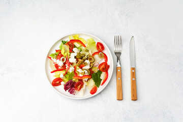 Fresh greek salad with feta cheese and vegetables for healthy eating and diet concept