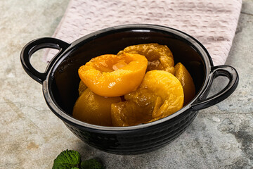 Canned marinated peach in syrop
