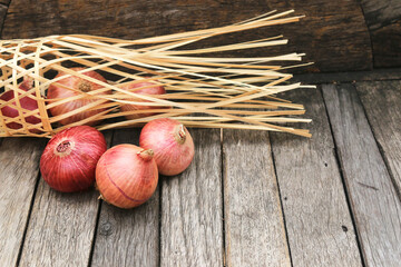 red onion on wooden table background