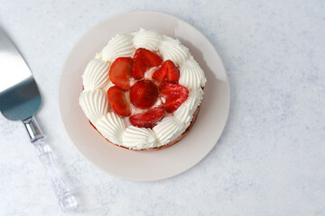 Strawberry cream cake on white plate dessert concept for celebration table or sweet food promotion