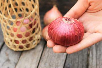 red onion on wooden table background