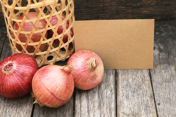 red onion on wooden table background