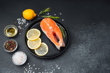 Fresh salmon fillet with lemon and herbs prepared for cooking