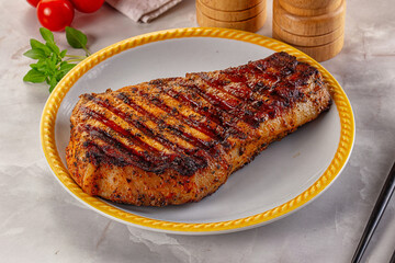 Grilled pork steak with bone