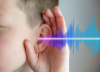 Closeup caucasian small childs ear, sound wave, Hearing Test, ringing or buzzing sensation,...