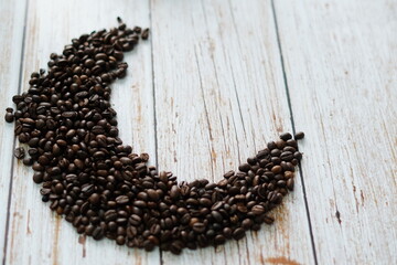 coffee beans on wooden surface