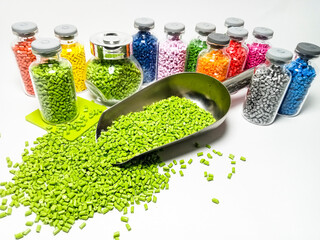 various colors of mastebatch granules in glass container, colorful pigment virgin resin, isolated...