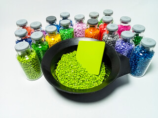 various colors of mastebatch granules in glass container, colorful pigment virgin resin, isolated...