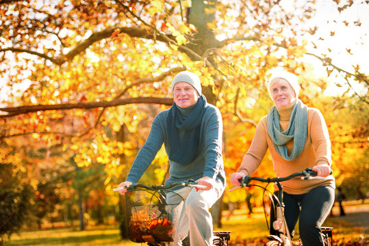 senior couple relaxing outdoors in autumn park