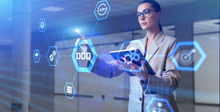 DDD Domain-driven design development concept. Young business woman pressing button on virtual screen. - Powered by Adobe