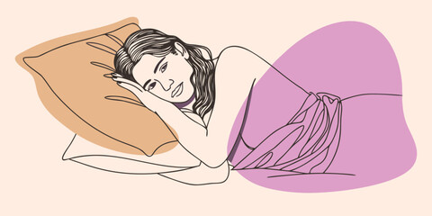 An elegant young woman with a flower in her hair and a towel around her body relaxes peacefully in a spa