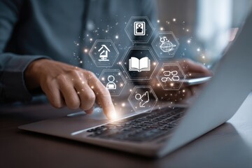 Person using laptop with digital icons overlay