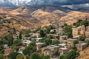 Fototapeta premium Village Amidst Mountains