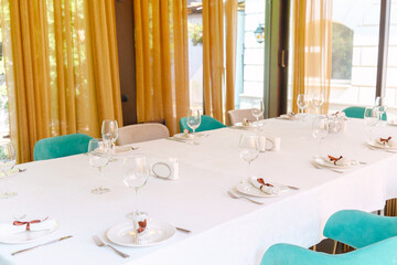 Elegant dining setup for special occasion in a bright restaurant