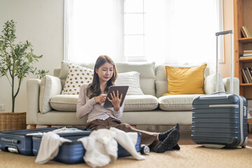 Portrait of woman use technology of tablet computer for hotel and resort booking online summer...