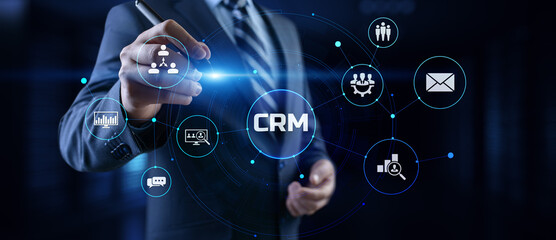 CRM Customer relationship management concept. Businessman pressing button on screen.