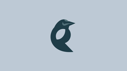 Obraz premium A stylized, minimalist illustration of a penguin, depicted in a solid, dark blue color against a light blue background.