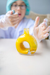 Children in protective gear engaging in hands-on chemistry experiment, curiosity and learning...