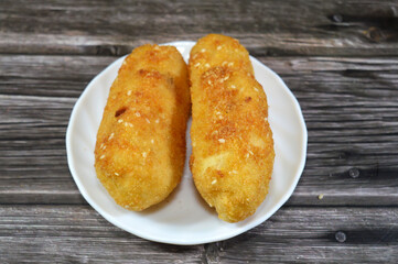 A plate of Potato Croquettes, croquette is a deep fried roll in French cuisine, a thick binder combined with a filling like mashed potatoes, which is then breaded, served as a side dish or a snack