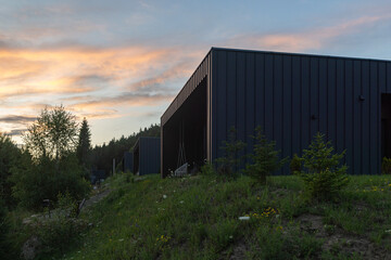 Obraz premium Modern building in the Carpathians at sunset