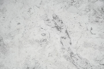 Footprints on light sandy surface captured in bright daylight