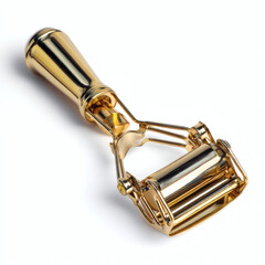 Naklejka premium Close up of a shiny gold plated eyelash curler with a white background showcasing its intricate design