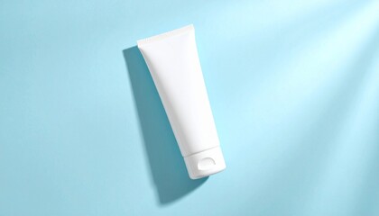 White Cosmetic Tube on Light Blue Background with Shadows