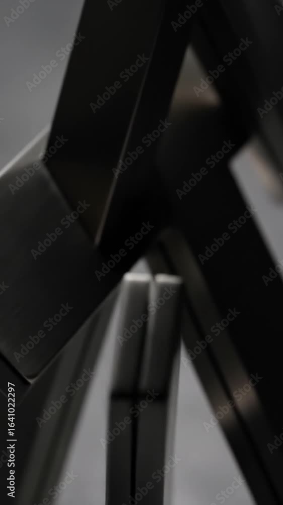 Aufkleber abstract geometric metal sculpture with intersecting lines on gray background creates a modern and s