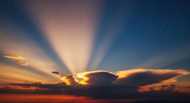 Radiant light beams piercing through celestial clouds at dusk create a majestic scenic display