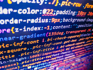 Web site codes on computer monitor. Programmer working on computer screen. Computer script coding source code on desktop monitor. Abstract computer script about big data and blockchain database