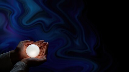 Spellcasting hands cradle a glowing orb in the corner, swirling abstract background fading into open space.