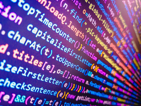 Real Java Script code developing screen. Blue color. Blue theme. Website HTML Code on the Laptop Display Closeup Photo. Coding, programming, hacking concept. Coding cyberspace concept