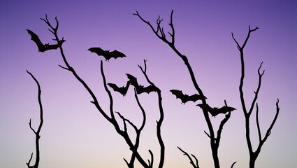 Silhouette of tree branches and flying bats on a misty gradient background.